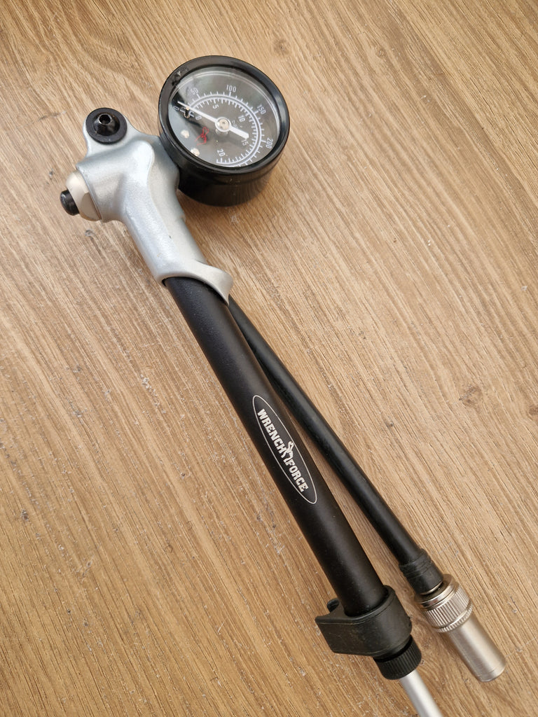 Wrench force shock pump