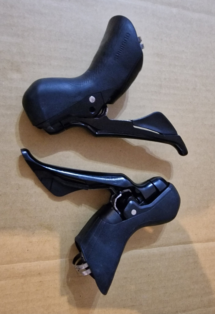 Shimano 7020 hydraulic shifters pair . Used but in excellent condition .